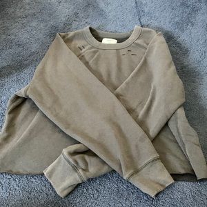 Blackish-grey crew neck cropped sweatshirt with cute cut outs around the neck